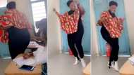 "Which school is this?" Pretty lecturer in high boots shakes her body to a beat as students watch