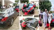 Nigerian lady surprises her husband with a new car on their 7th wedding anniversary, photos spark reactions
