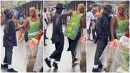Man dances like Michael Jackson beside lady in market, she pushes him away, people watch