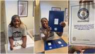 "N80m well spent": Netizens rejoice with Hilda Baci as she excitedly opens Guinness plaque and certificate