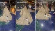 "This marriage is already blessed": Reactions as kid lies on bride's flowing dress while she dances