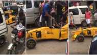 Young Nigerian boy drives sports car he built himself on road, wows many as people give him cash, clip emerges