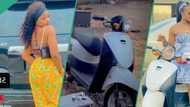 Nigerian lady buys bike, pours drink, dances happily and drives it around compound
