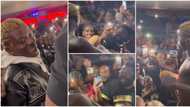 Londoners gather round Portable, scream excitedly and sing his songs word for word as he starts to perform