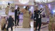 Drama as lady 'scatters' wedding, removes her wig as she dances and shoots dollars in the air, video wows many