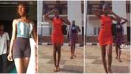 “I’m in love with your height”: Very tall Igbo lady in short red gown causes stir online with viral video