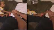 Small side chick: Little girl tells dad to massage her foot in funny video after catching him doing it to wife