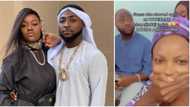Lady removes scarf, adjusts hair as Davido shows up in Chioma's church for worship