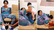 "The best mum": Beautiful mother who has no hands uses legs to carry her baby, video melts hearts