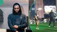 Kizz Daniel's 'Hulk Hogan' bodyguard angrily throws overzealous fan off stage: "E warn am na"