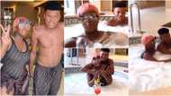 DJ Cuppy and brother Fewa wear matching designer costumes as they go swimming, teaches him to use water gun