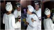 Make baba no fall o: Nigerians react as Alaafin Oyo parties hard with his young wife, sprays her naira notes