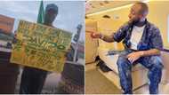 Nigerian man takes to the street with placard, says he wants to meet Davido, stirs massive reactions online