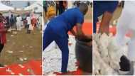 Couple use rubber container to pack money at wedding in viral video, Nigerians react