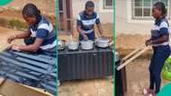 Talented lady constructs moveable charcoal stove with wood and zinc, cooks with it in viral video