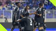 Taye Taiwo goes on one knee, shines Okocha's boots after stunner in novelty match, video