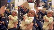 "They know themselves from past life": Baby gives woman side eye, maintains his frown