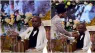 "Dey chew cake like pounded yam": Video shows Isreal DMW with 'strong' face as wife feeds him at their wedding