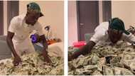 Zazu don cash out again: Portable says, shows off wads of foreign currency that takes an entire bed space
