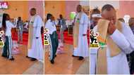 Lady enters church and dances for reverend father, gives him cake, video goes viral and gets 3.3 million views
