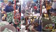 Grateful son storms Lagos market with cake and music to celebrate his okra seller mother on her birthday
