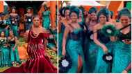 Video of bride in regal red dress and asoebi ladies in green wows wedding lovers