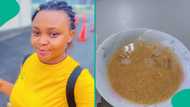 Nigerian lady shares traditional garri and moimoi experience with Japanese colleague at work