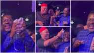 Secure the bag: Reactions as Kanayo O. Kanayo holds on tightly to wads of cash sprayed on him at party