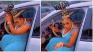 Video of woman unable to enter her car due to tall hairstyle goes viral: "Cut the top and glue it back"