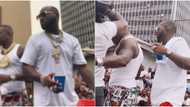 Davido takes US rapper DaBaby to Lagos trenches with huge crowd for their music video shoot, Nigerians react