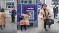 Lady destroys bank's ATM with one of her heels over an unresolved issue with her account, wows Oyinbos in clip