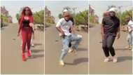He's trying hard to keep up: Reactions as big man dances among 2 others in viral video