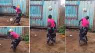 Woman in wrapper shows impressive football skills, juggles ball with her legs, head and shoulder non-stop