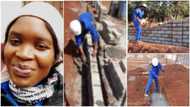 Young lady who is a bricklayer showcases her work with pride in photos