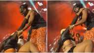 Married man doings: Adekunle Gold watches as dancer falls off while attempting to rough handle him on stage