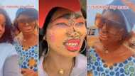 "Swagger mama": Nigerian woman with face piercings, coloured teeth and excess make-up poses with daughter