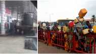 Fuel scarcity: Nigerians react to viral video of fuel being bought at filling station in a tank