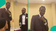 Nigerian mother reacts with disbelief as her two grown sons braid their hair