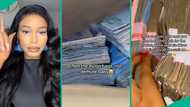 Nigerian lady displays nylons filled with cash, shares source of money in viral video, people react