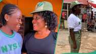 Young lady salutes mother in her NYSC uniform to appreciate her support