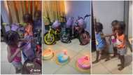 Nigerian mother gives 3 different cakes, bicycles to her triplets on their birthday, lovely video goes viral