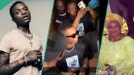 Wizkid tells fans to keep calm as they chant his name during mum's candlelight procession