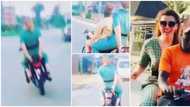 Pretty Oyinbo lady spotted riding okada in Lagos, she put both hands at the back in the video, Nigerians react