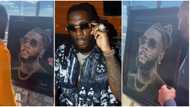 Oyinbo artist stuns Burna Boy with portrait gift made of diamonds & crystals in viral video