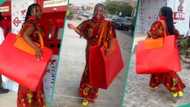 Drama as Nigerian girl is captured on the road with gigantic red bag, video goes viral