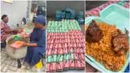 Nigerian lady makes many smile, feeds 252 people jollof rice & 2 meat each, photos stir reactions