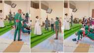 Bride treated like a queen at wedding as her military groom and his boys prostrate in uniforms before her