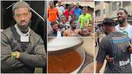 British rapper Tion Wayne storms Nigerian hood, snaps photos with residents, eats local food, man raps for him