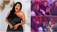 Toyin Abraham leaves Tiwa Savage blushing as she rains cash on singer at star-studded Valentine's Day party