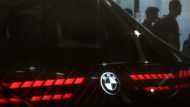 BMW says can weather tariff storm despite profit plunge